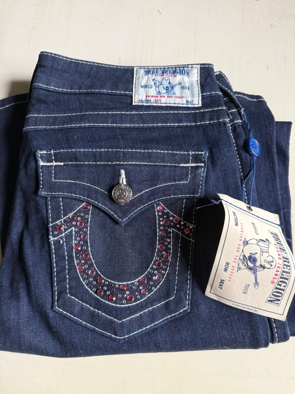 True Religion Dark Blue Denim Flare Jeans with Red Rhinestone Horseshoe Accent